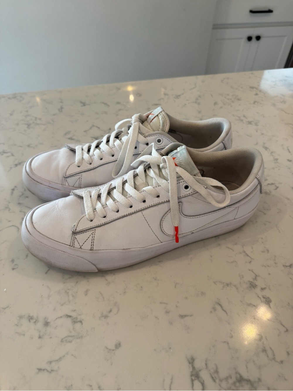 Nike White Leather Low-Top Sneakers with Subtle Orange Accent - Men's